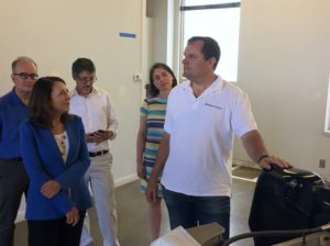 Tom Ranken (CEO, CleanTech Alliance), US Senator Maria Cantwell, Dan Schwartz (Director, Clean Energy Institute, University of Washington), and Laura Blackmore (Deputy Director, Puget Sound Partnership) listen to Andy Rebele (CEO of Pure Watercraft)